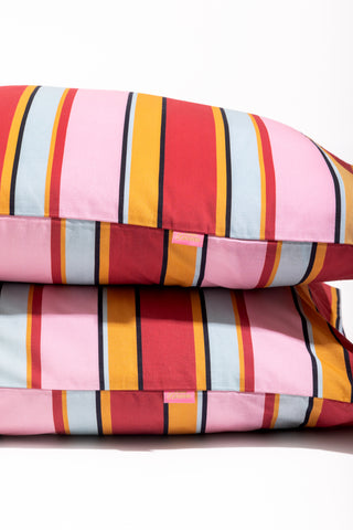 karavan clothing fashion spring summer 24 that moment homeware collection striped pillowcase red orange