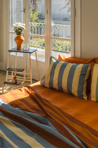 karavan clothing planet homeware collection fall winter 24 25 percale fitted sheet orange